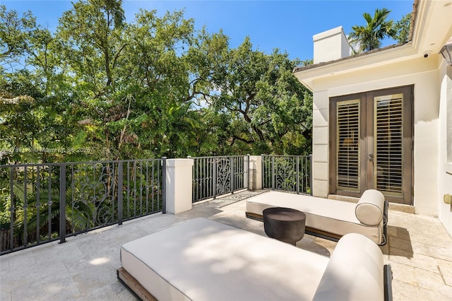 1672 Micanopy Ave, Miami, FL 33133 - view of patio / terrace featuring french doors
