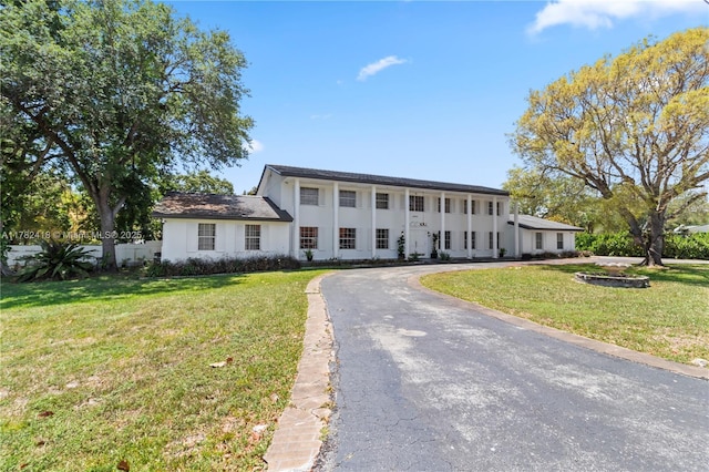 8350 SW 98 Th St, Miami, FL 33156 - colonial home featuring stucco siding, aphalt driveway, and a front yard