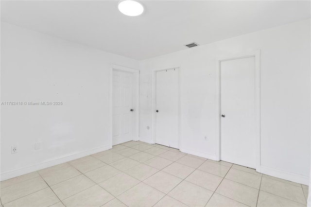 8350 SW 98 Th St, Miami, FL 33156 - spare room featuring baseboards, visible vents, and light tile patterned floors