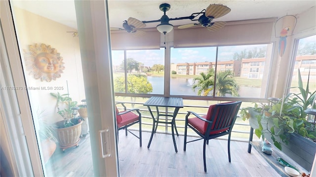 9681 Sunrise Lakes Blvd Unit 209, Sunrise, FL 33322 - sunroom / solarium with wood finished floors and a water view