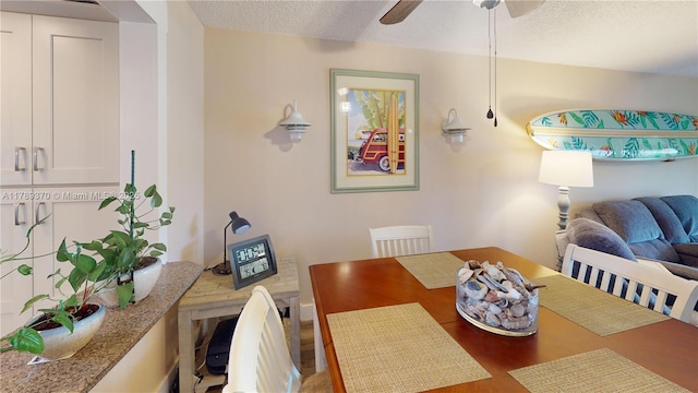 9681 Sunrise Lakes Blvd Unit 209, Sunrise, FL 33322 - dining room with ceiling fan, wood finished floors, and a textured ceiling