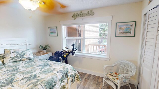 9681 Sunrise Lakes Blvd Unit 209, Sunrise, FL 33322 - bedroom with ceiling fan, baseboards, and wood finished floors