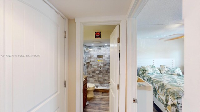 9681 Sunrise Lakes Blvd Unit 209, Sunrise, FL 33322 - hallway featuring wood finished floors
