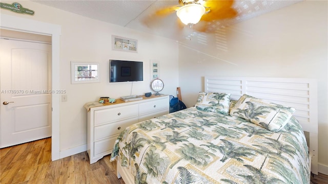 9681 Sunrise Lakes Blvd Unit 209, Sunrise, FL 33322 - bedroom featuring light wood-style flooring, baseboards, and ceiling fan