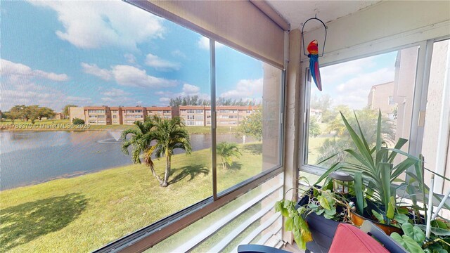 9681 Sunrise Lakes Blvd Unit 209, Sunrise, FL 33322 - sunroom / solarium featuring a water view