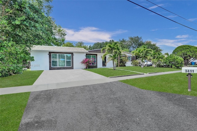 3411 SW 36th St, West Park, FL 33023 - ranch-style home with stucco siding and a front lawn