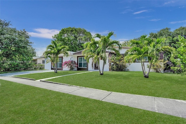 3411 SW 36th St, West Park, FL 33023 - view of front of home featuring stucco siding and a front lawn