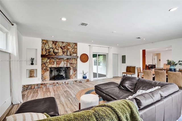 3411 SW 36th St, West Park, FL 33023 - living area with wood finished floors, a fireplace, and recessed lighting