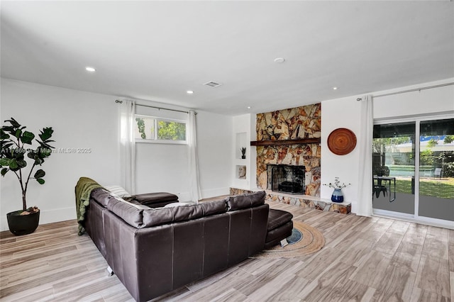 3411 SW 36th St, West Park, FL 33023 - living area with a stone fireplace, light wood finished floors, and recessed lighting