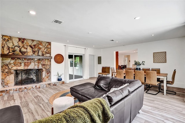 3411 SW 36th St, West Park, FL 33023 - living room with light wood-type flooring, recessed lighting, a stone fireplace, and electric panel