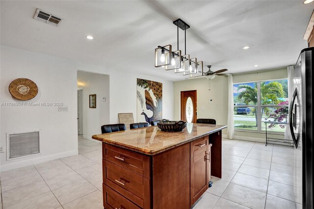 3411 SW 36th St, West Park, FL 33023 - kitchen featuring a kitchen island, light tile patterned floors, a ceiling fan, light stone countertops, and recessed lighting