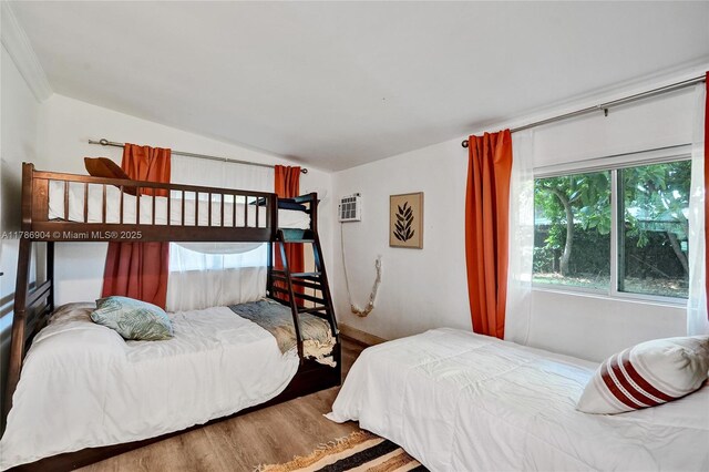 3411 SW 36th St, West Park, FL 33023 - bedroom featuring wood finished floors and vaulted ceiling