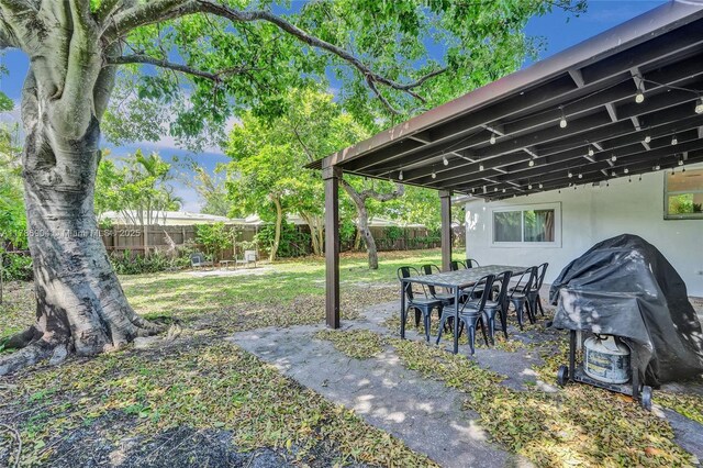 3411 SW 36th St, West Park, FL 33023 - fenced backyard featuring a patio area