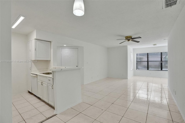 interior space with light tile patterned floors, visible vents, and ceiling fan