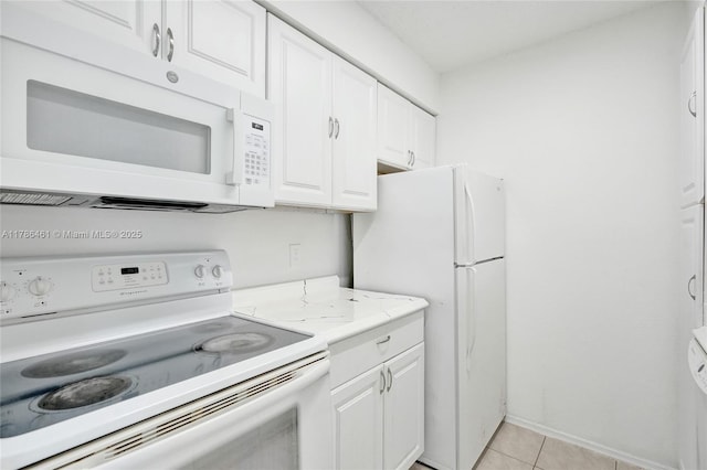 kitchen with white cabinets, white appliances, light tile patterned flooring, and light countertops