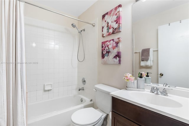 full bath with toilet, vanity, and shower / bath combo with shower curtain