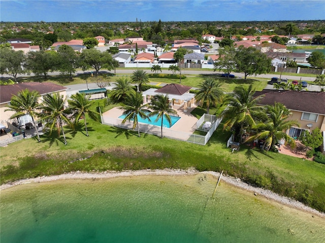 drone / aerial view featuring a residential view and a water view
