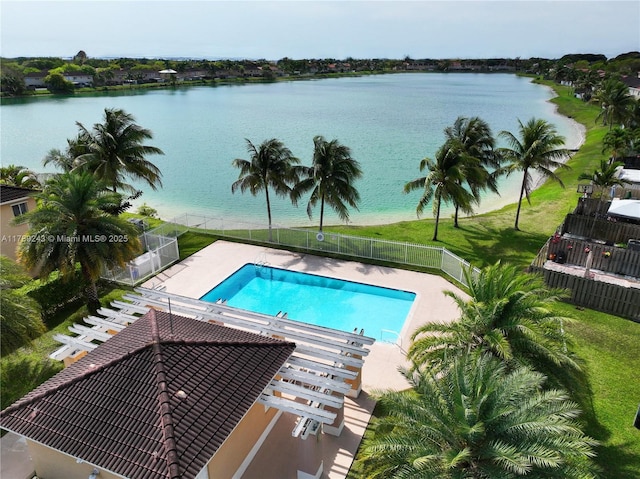 pool featuring fence and a water view