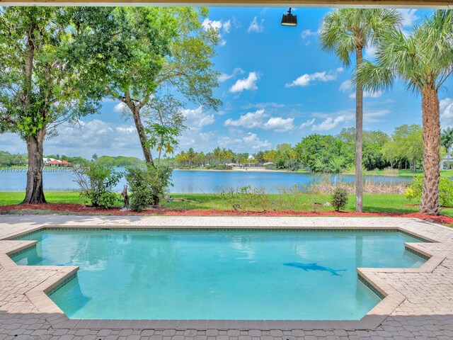 swimming pool featuring a water view
