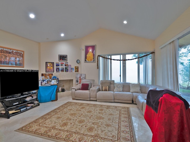 living room featuring vaulted ceiling and recessed lighting