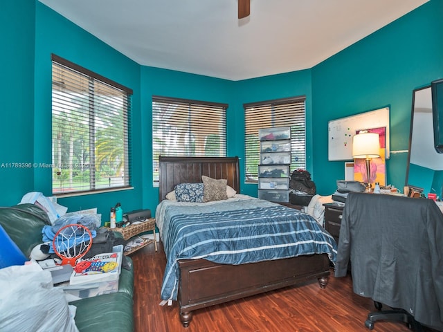 bedroom with wood finished floors and a ceiling fan