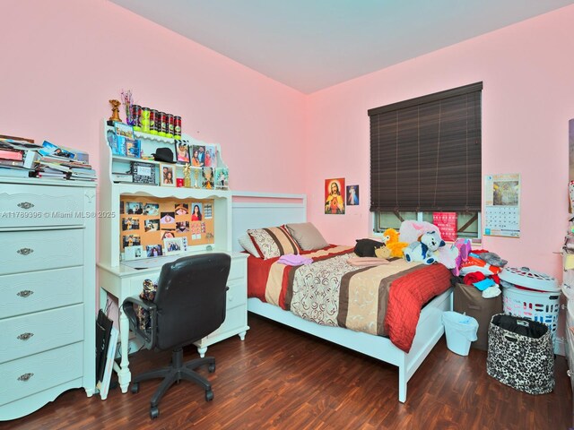 bedroom featuring wood finished floors