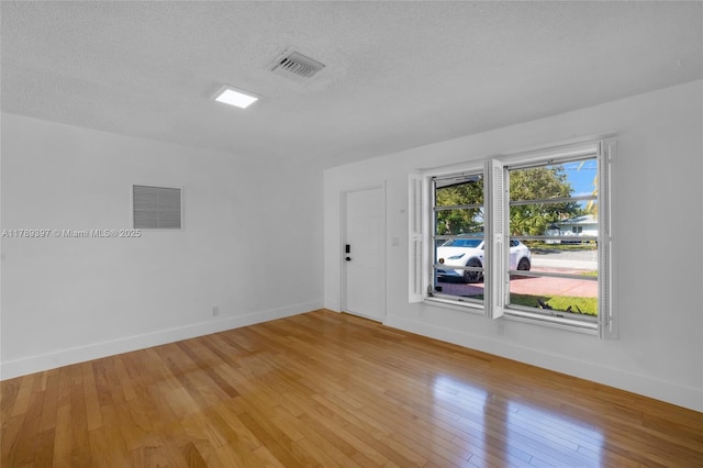2020 NW 33rd Ct, Oakland Park, FL 33309 - unfurnished room with baseboards, light wood finished floors, and visible vents