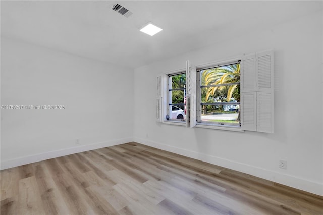 2020 NW 33rd Ct, Oakland Park, FL 33309 - empty room featuring wood finished floors, visible vents, and baseboards