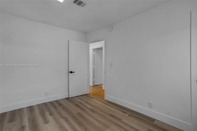 2020 NW 33rd Ct, Oakland Park, FL 33309 - empty room with baseboards, wood finished floors, and visible vents