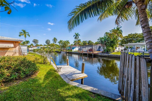 2020 NW 33rd Ct, Oakland Park, FL 33309 - dock area with a lawn, a residential view, and a water view