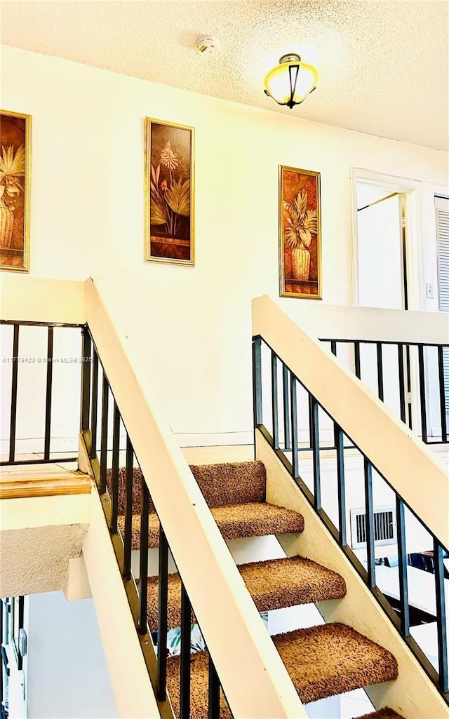 2554 N 38th Ave Unit C-26, Hollywood, FL 33021 - stairs with a textured ceiling