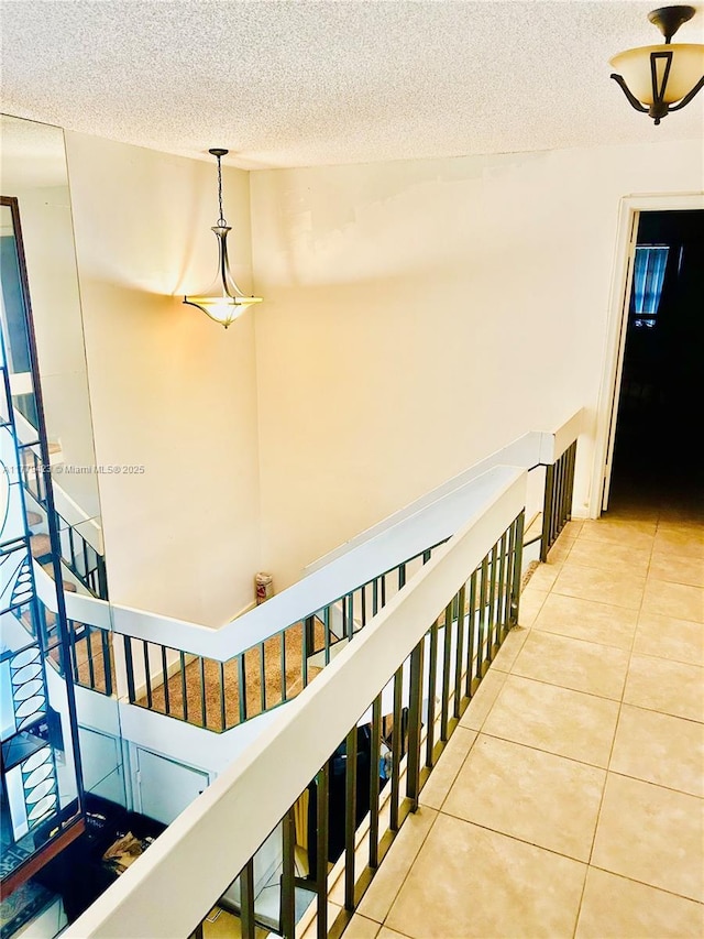 2554 N 38th Ave Unit C-26, Hollywood, FL 33021 - stairs featuring a textured ceiling and tile patterned flooring