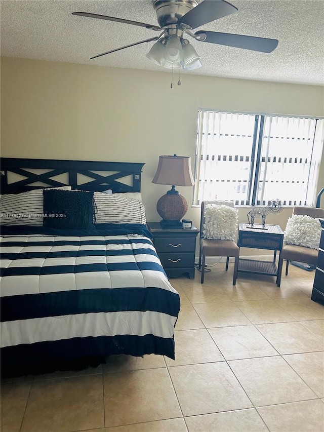 2554 N 38th Ave Unit C-26, Hollywood, FL 33021 - bedroom featuring a textured ceiling, light tile patterned floors, and a ceiling fan