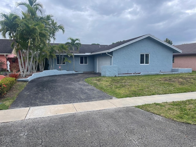 7522 SW 6th St, North Lauderdale, FL 33068 - ranch-style home featuring driveway, stucco siding, a garage, and a front lawn