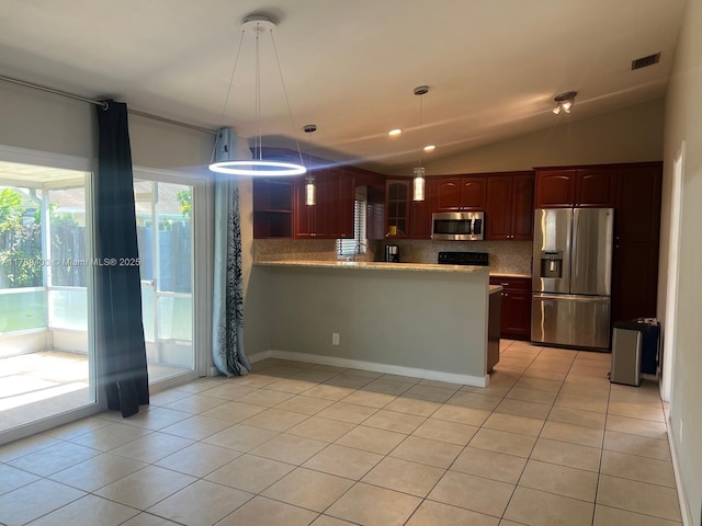 7522 SW 6th St, North Lauderdale, FL 33068 - kitchen with appliances with stainless steel finishes, light tile patterned floors, lofted ceiling, backsplash, and light countertops