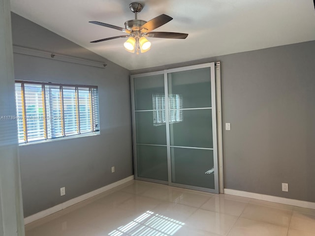 7522 SW 6th St, North Lauderdale, FL 33068 - unfurnished bedroom with vaulted ceiling, light tile patterned flooring, a ceiling fan, and a closet