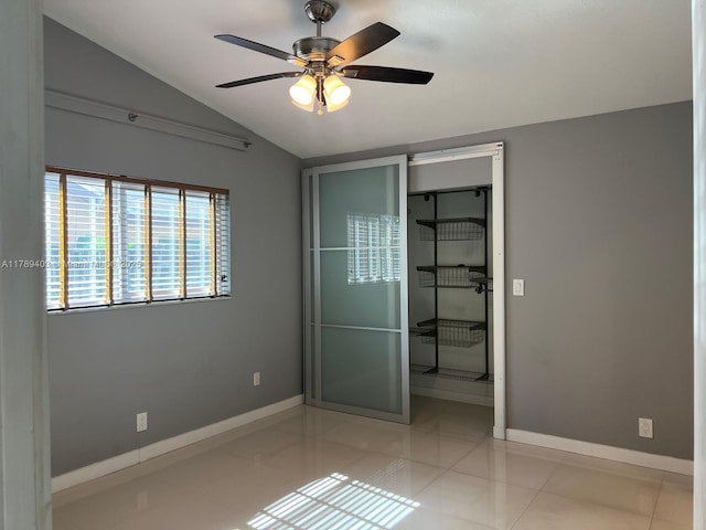 7522 SW 6th St, North Lauderdale, FL 33068 - unfurnished bedroom with lofted ceiling, ceiling fan, and light tile patterned floors