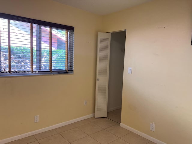 7522 SW 6th St, North Lauderdale, FL 33068 - empty room featuring light tile patterned floors and baseboards