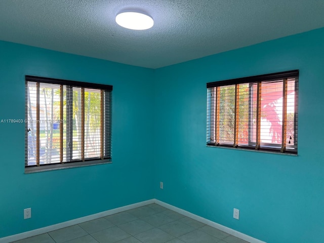 7522 SW 6th St, North Lauderdale, FL 33068 - tiled spare room featuring a textured ceiling and baseboards