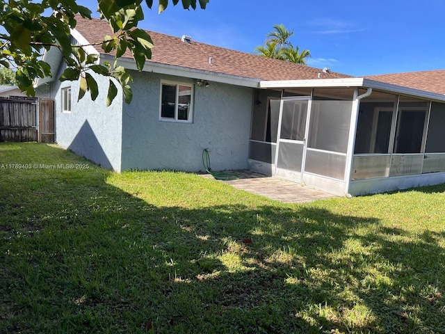7522 SW 6th St, North Lauderdale, FL 33068 - back of house featuring stucco siding, a sunroom, and roof with shingles