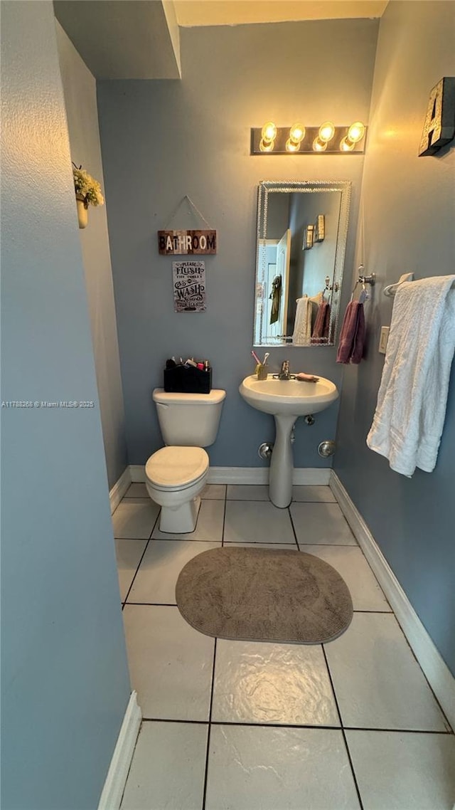 12222 SW 148th St, Miami, FL 33186 - half bathroom featuring tile patterned floors, baseboards, and toilet