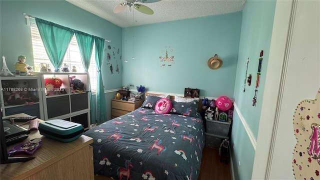12222 SW 148th St, Miami, FL 33186 - bedroom with a textured ceiling, a ceiling fan, and wood finished floors