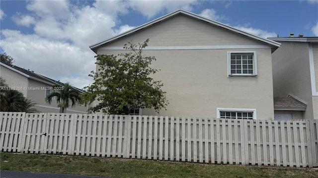 12222 SW 148th St, Miami, FL 33186 - view of home's exterior featuring stucco siding and fence