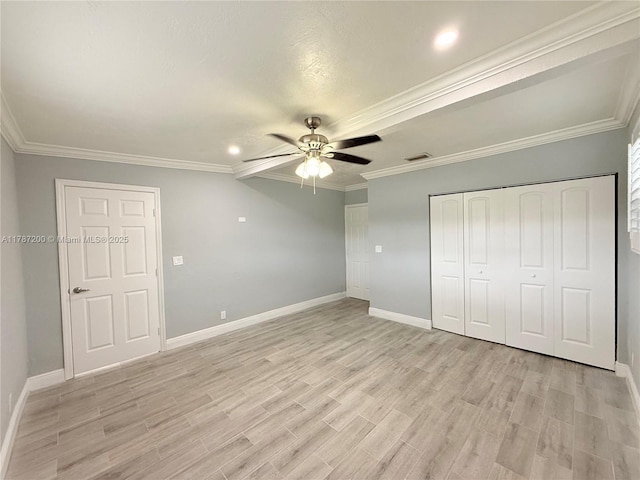 unfurnished bedroom with baseboards, visible vents, and light wood-type flooring