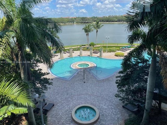 2681 N Flamingo Rd Unit 1501S, Sunrise, FL 33323 - view of swimming pool with a water view and a pool with connected hot tub