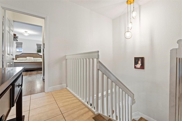 14637 SW 15th St, Pembroke Pines, FL 33027 - hall featuring an upstairs landing, light tile patterned floors, and baseboards