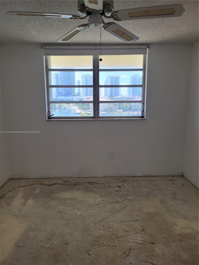 2930 Point E Dr Unit E603, Aventura, FL 33160 - unfurnished room with a ceiling fan and a textured ceiling