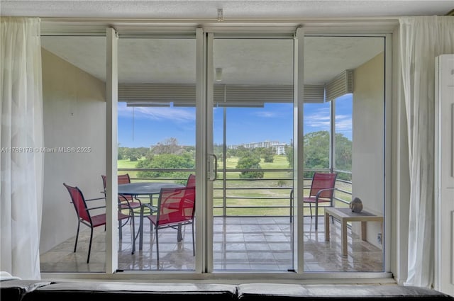 2671 S Course Dr Unit 409, Pompano Beach, FL 33069 - doorway to outside featuring plenty of natural light
