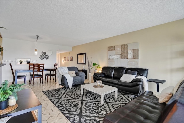2671 S Course Dr Unit 409, Pompano Beach, FL 33069 - living area with a textured ceiling