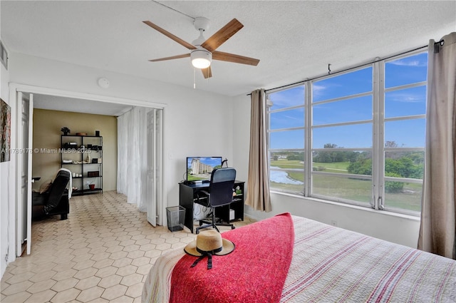 2671 S Course Dr Unit 409, Pompano Beach, FL 33069 - bedroom with visible vents and a ceiling fan